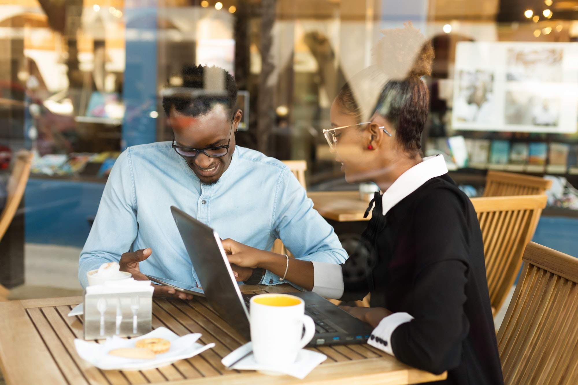 Black African American coworkers doing digital teamwork arround